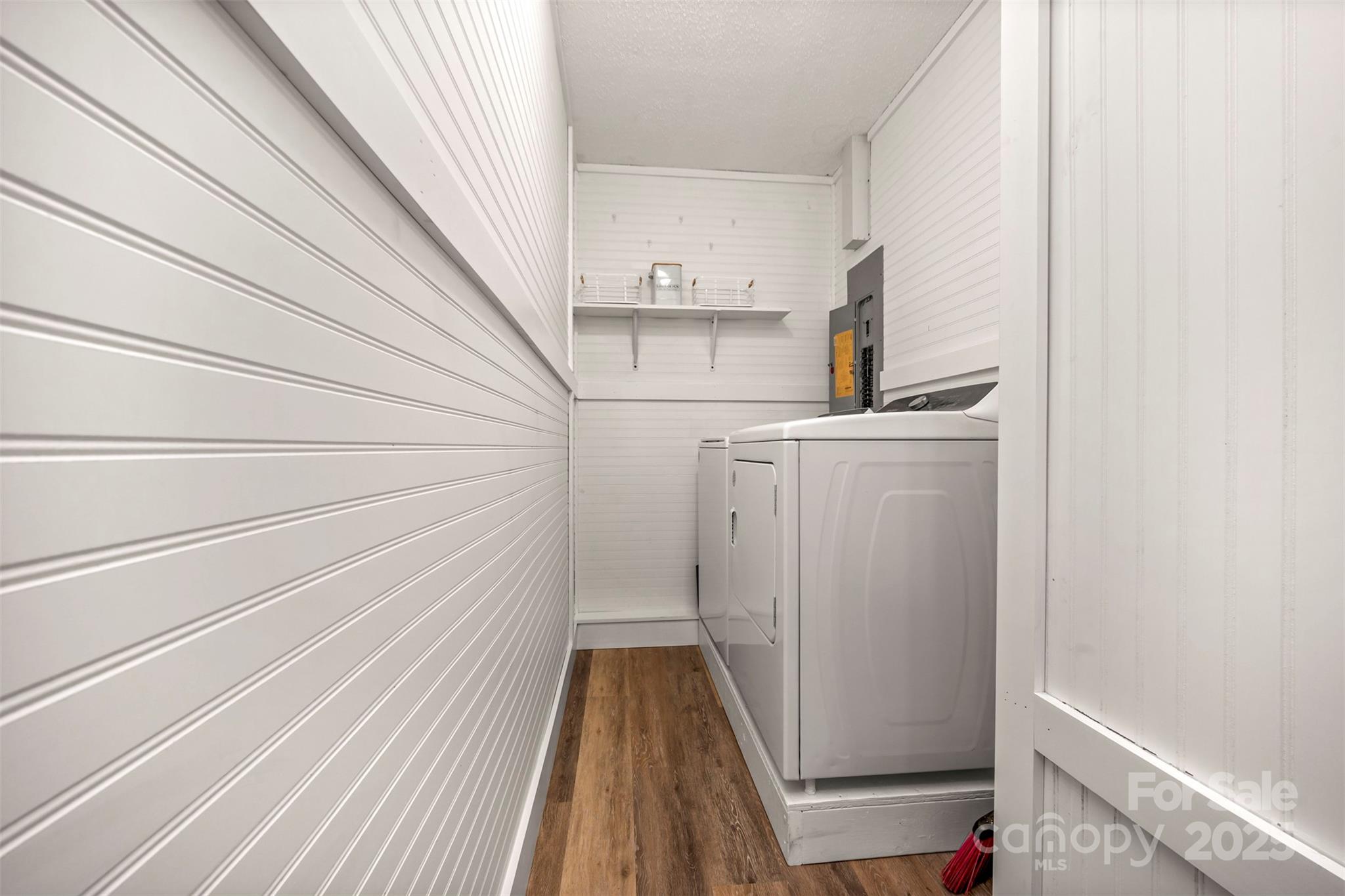 569 Lanning Road Hendersonville, NC 28792 - Photo 12 of 32 a view of storage and utility room with wooden floor