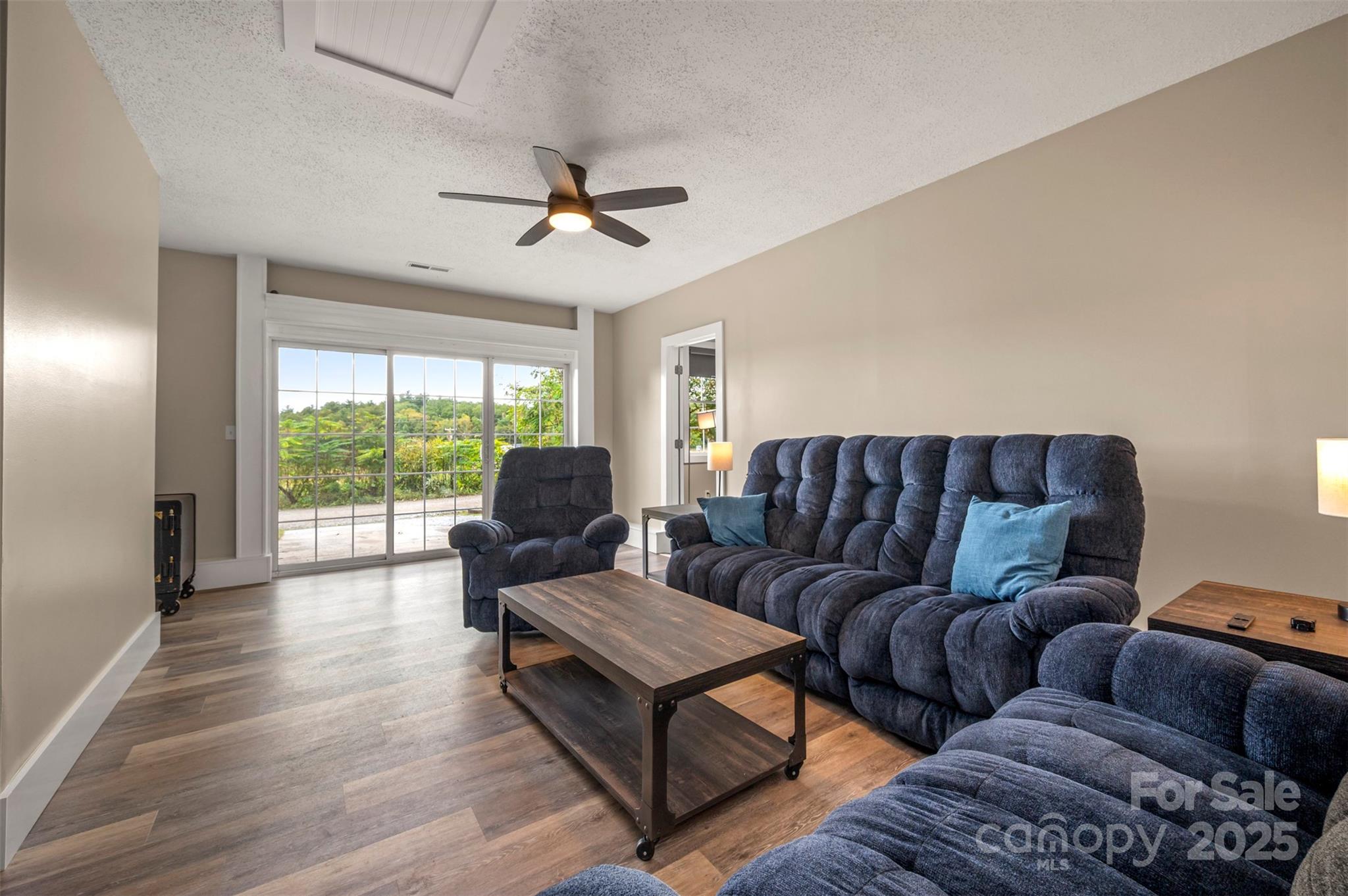 569 Lanning Road Hendersonville, NC 28792 - Photo 13 of 32 a living room with furniture and a large window