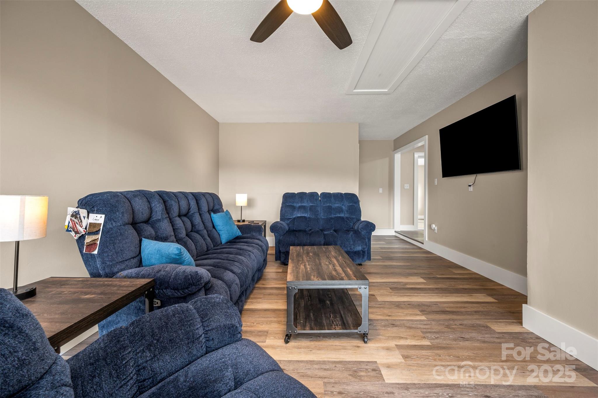 569 Lanning Road Hendersonville, NC 28792 - Photo 14 of 32 a living room with furniture and a flat screen tv