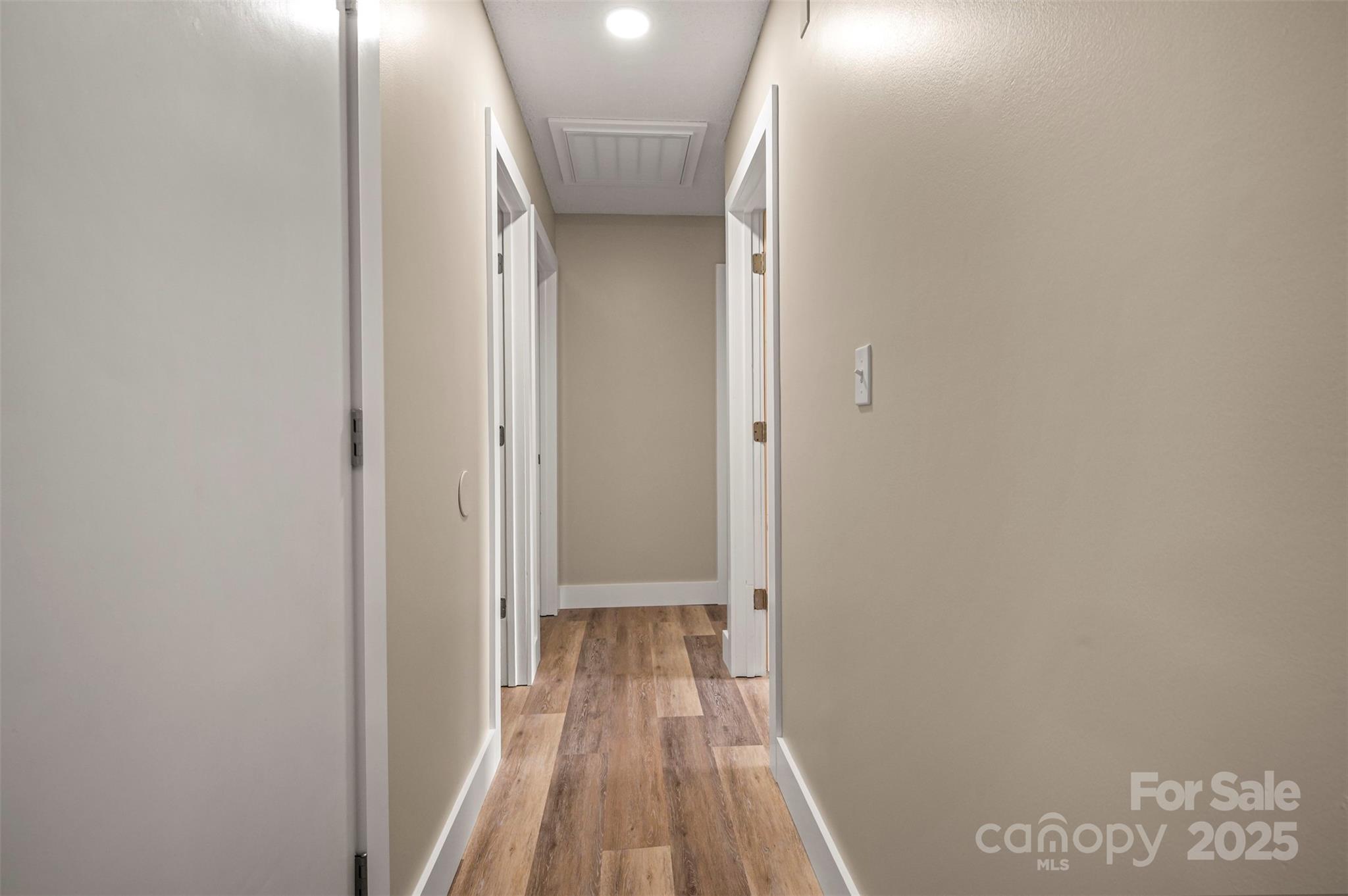 569 Lanning Road Hendersonville, NC 28792 - Photo 20 of 32 a view of a room with wooden floor