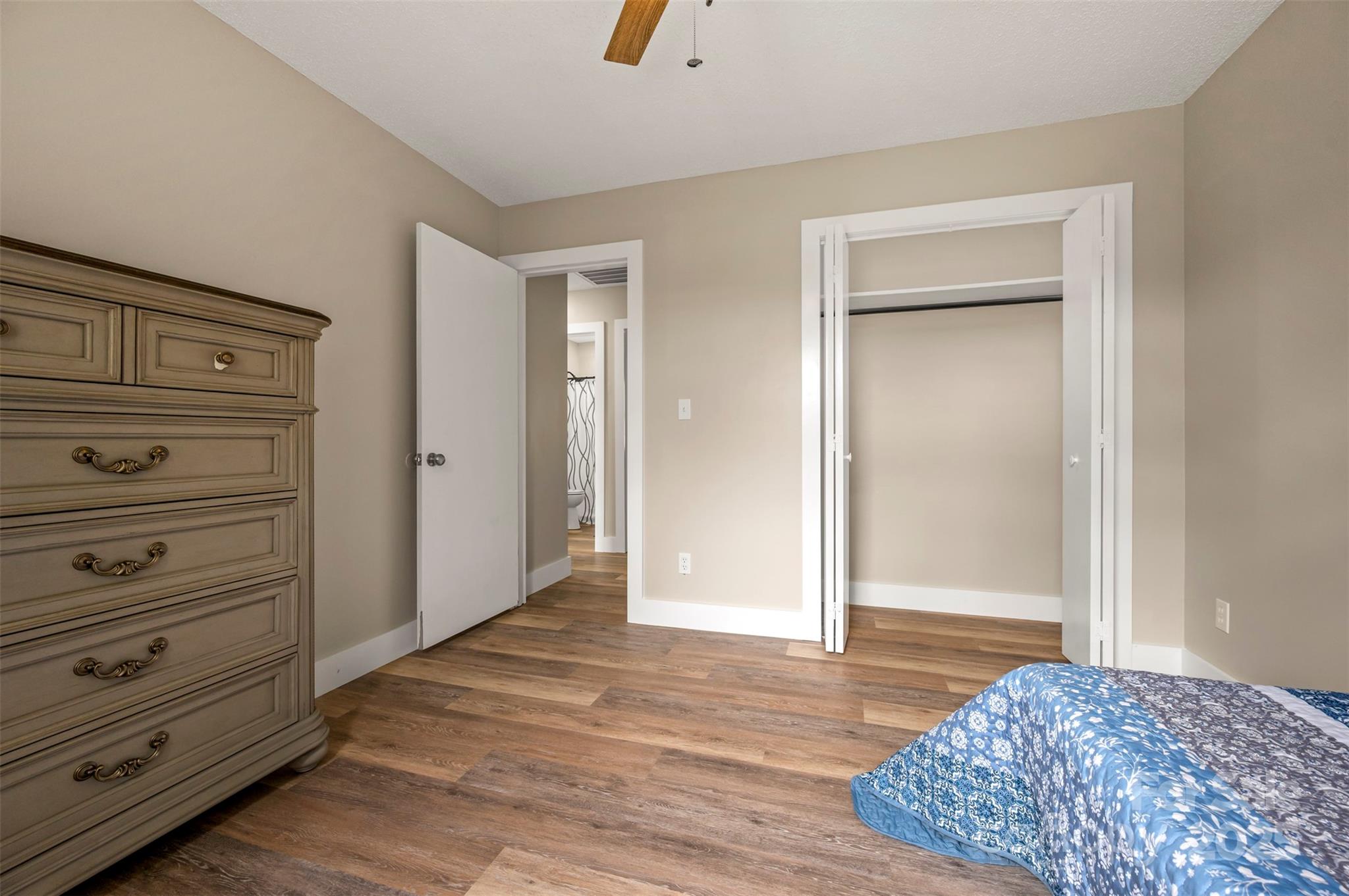 569 Lanning Road Hendersonville, NC 28792 - Photo 28 of 32 a view of walk in closet with hardwood floor