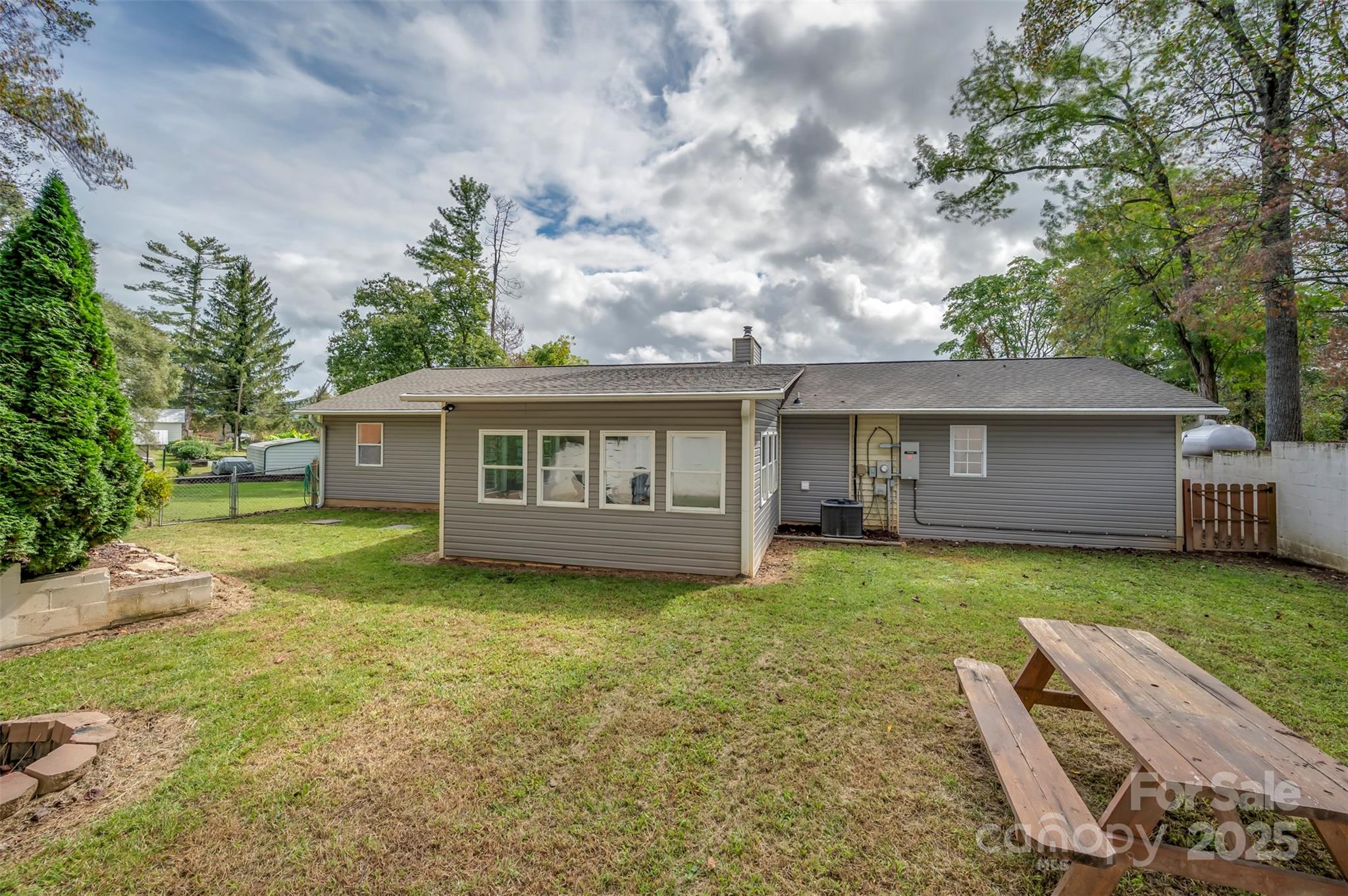 569 Lanning Road Hendersonville, NC 28792 - Photo 31 of 32 a view of a house with a yard