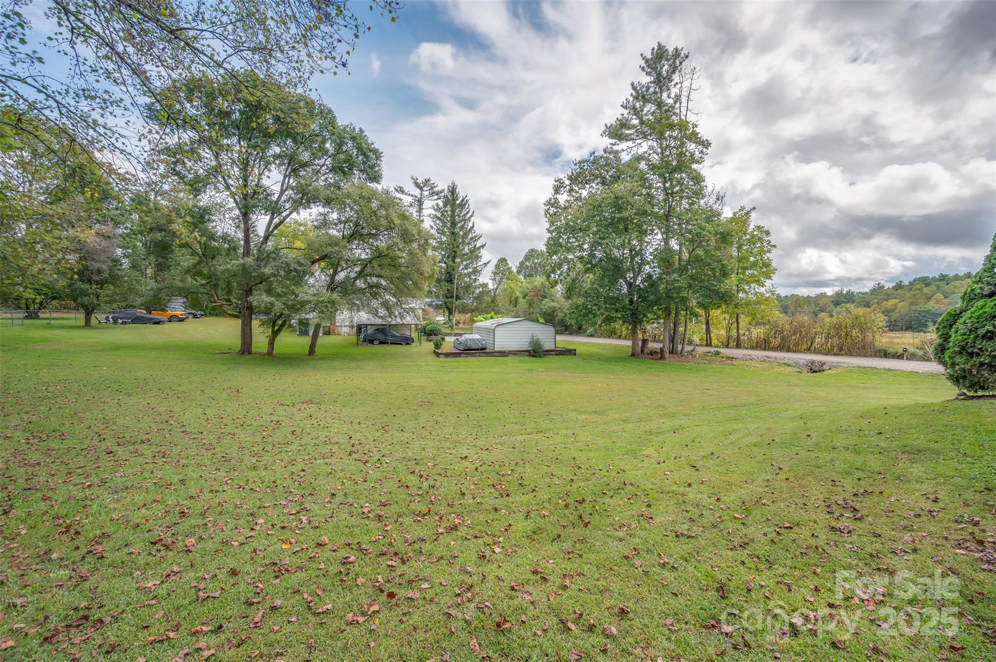 569 Lanning Road Hendersonville, NC 28792 - Photo 32 of 32 a view of yard with swimming pool and green space