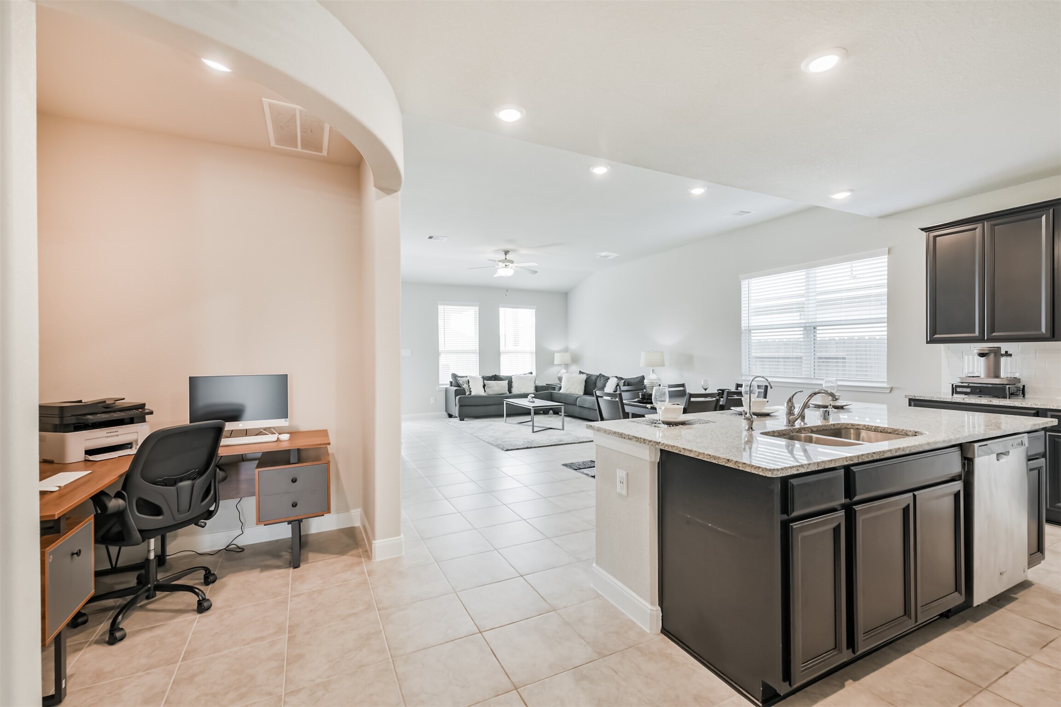 918 Pismo Lane Rosharon, TX 77583 - Photo 13 of 44 a kitchen with a sink a counter top space appliances and cabinets