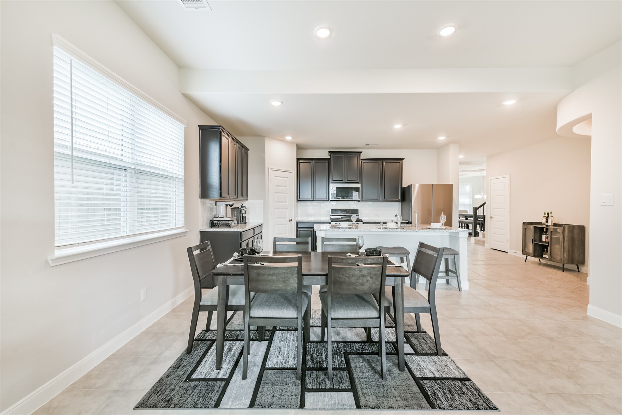 918 Pismo Lane Rosharon, TX 77583 - Photo 8 of 44 a view of a dining room with furniture and wooden floor