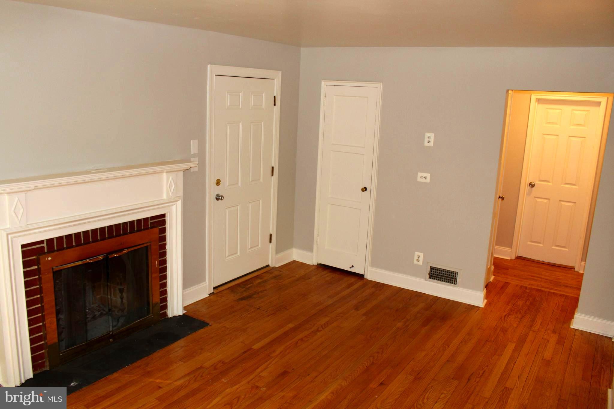 11810 Grandview Avenue Silver Spring, MD 20902 - Photo 3 of 33 Living room with fireplace