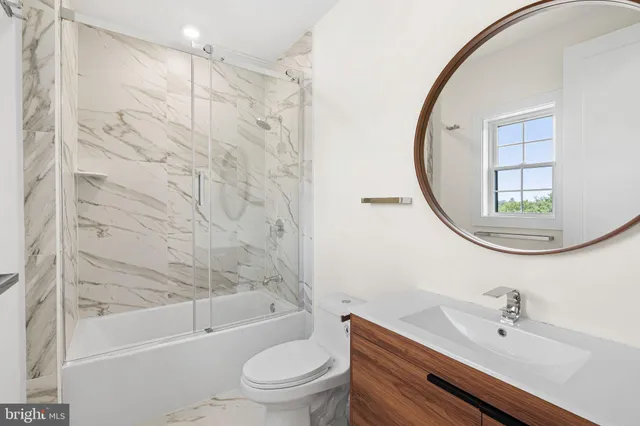 a kitchen with stainless steel appliances granite countertop a stove and a wooden floors