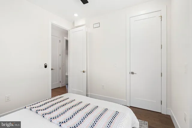 a bedroom with a bed and a shower