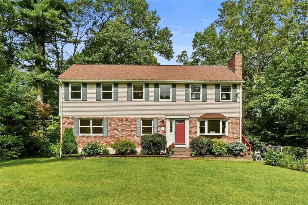 50 Middle Road Amesbury, MA 01913 - Photo 1 of 30 a front view of a house with a garden