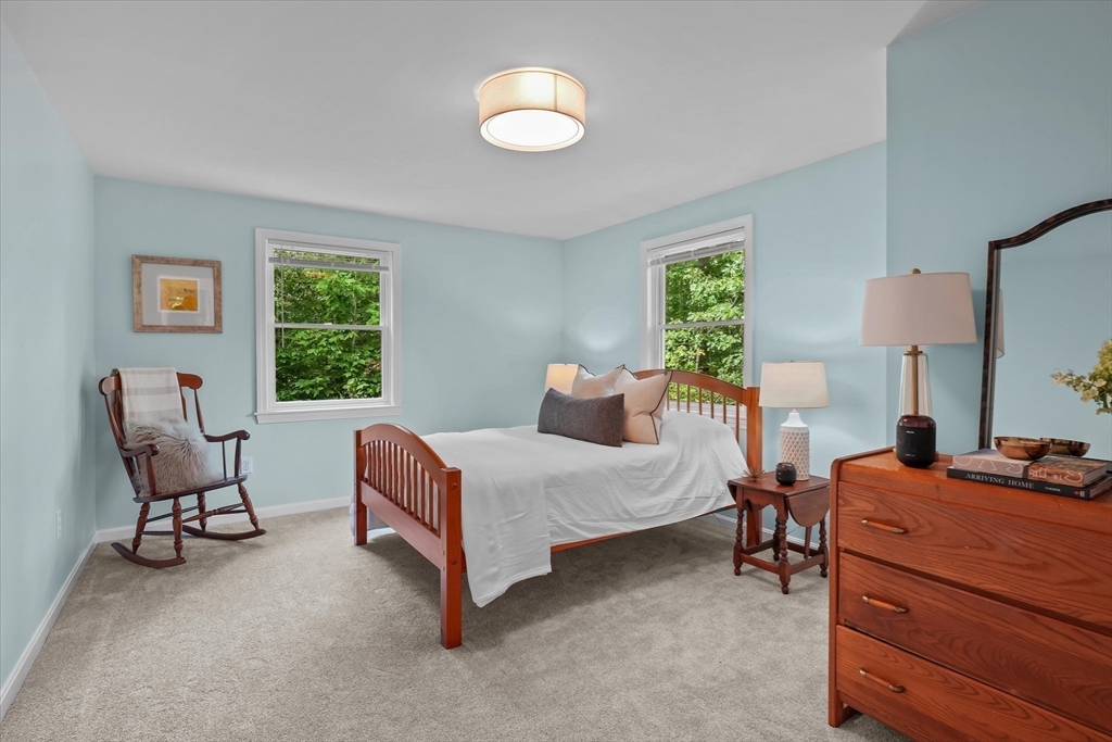 50 Middle Road Amesbury, MA 01913 - Photo 16 of 30 a bedroom with a bed chair and window