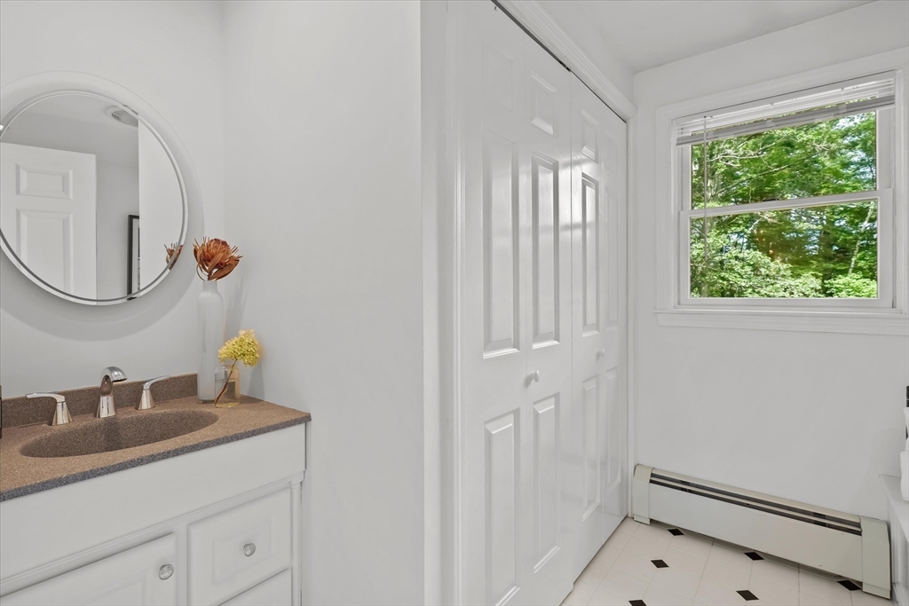 50 Middle Road Amesbury, MA 01913 - Photo 18 of 30 a bathroom with a sink and a mirror