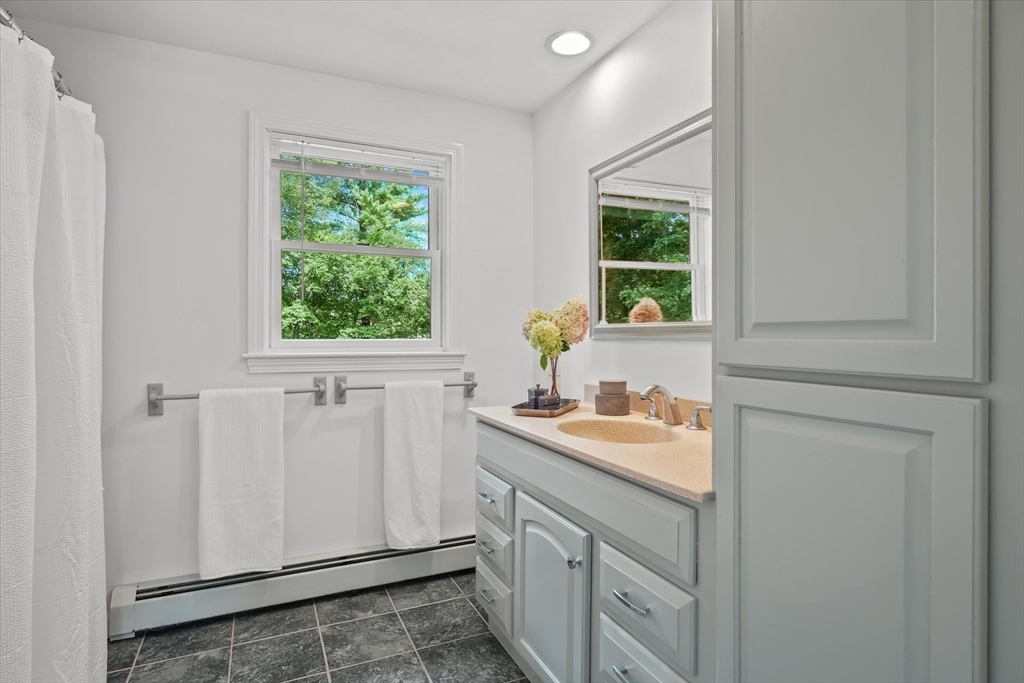 50 Middle Road Amesbury, MA 01913 - Photo 19 of 30 a bathroom with a sink and a window