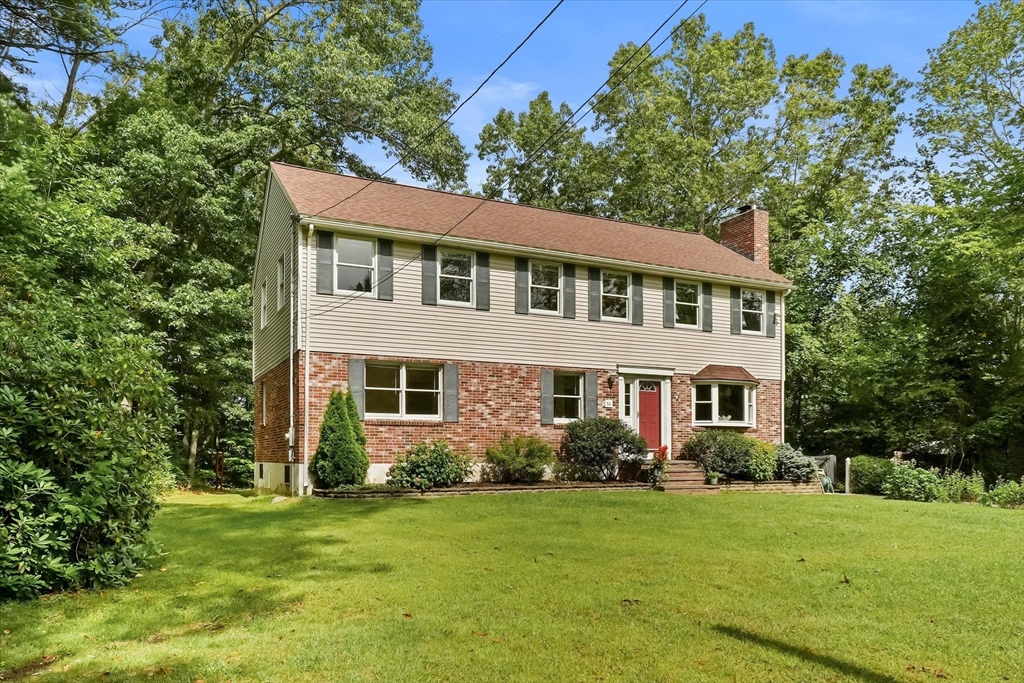 50 Middle Road Amesbury, MA 01913 - Photo 2 of 30 a front view of a house with a garden