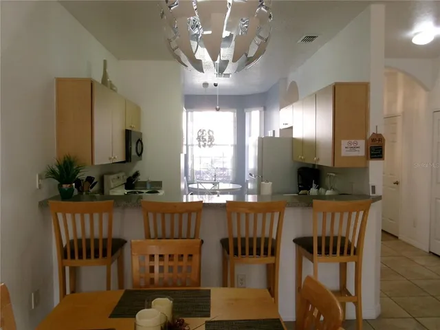 a kitchen with a stove and a microwave