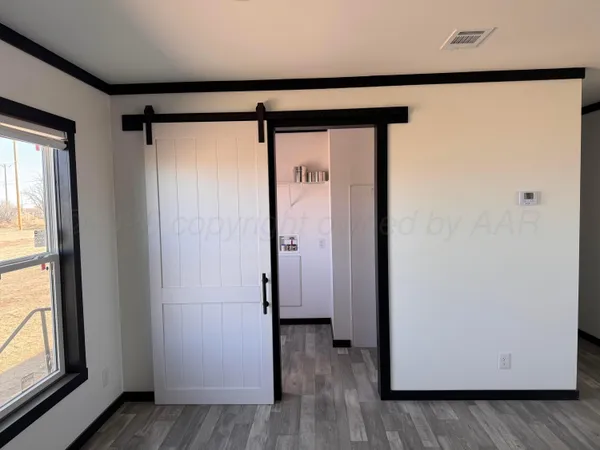 a view of front door with wooden floor