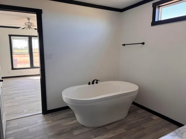 a white bath tub sitting in a bathroom