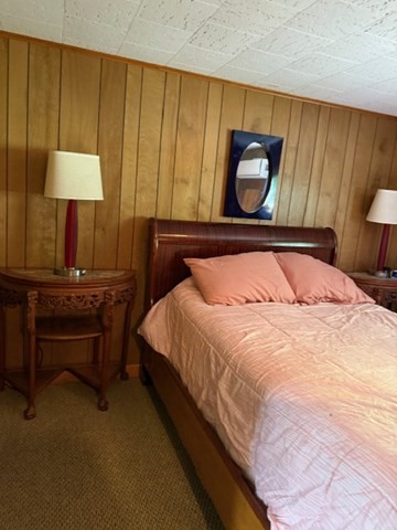 45 Spring Street Lunenburg, MA 01462 - Photo 13 of 14 a bedroom with a bed lamps and a table in it