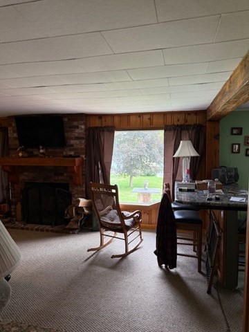 45 Spring Street Lunenburg, MA 01462 - Photo 14 of 14 a living room with furniture a fireplace and a flat screen tv