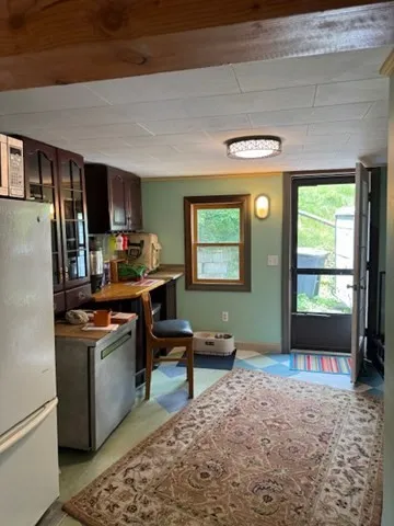 a kitchen with stainless steel appliances granite countertop a refrigerator stove and sink