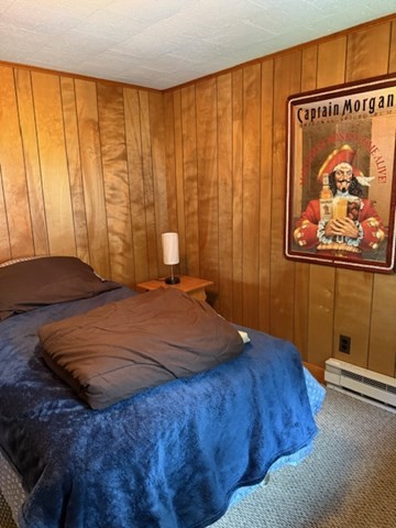 45 Spring Street Lunenburg, MA 01462 - Photo 4 of 14 a bedroom with a bed and a window