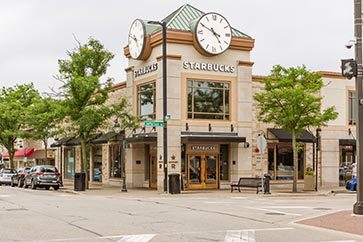 1033 Emerald Drive Naperville, IL 60540 - Photo 12 of 13 a view of a brick building with a clock on the top