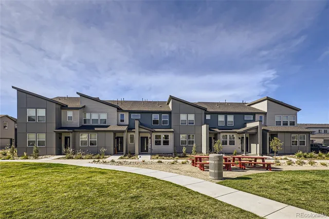 a front view of building with outdoor seating