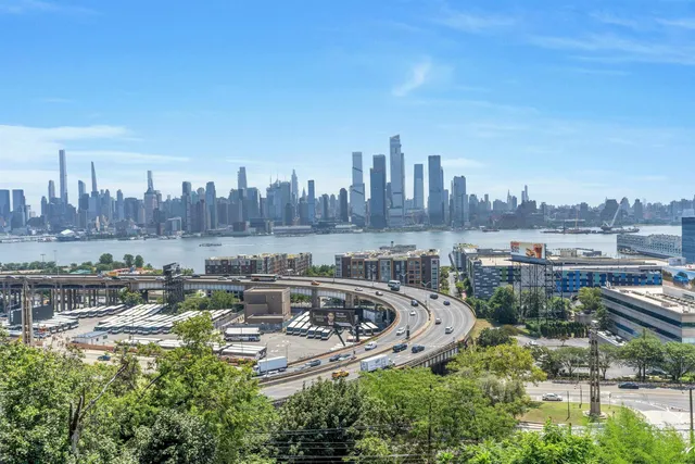 a view of city and a tall buildings
