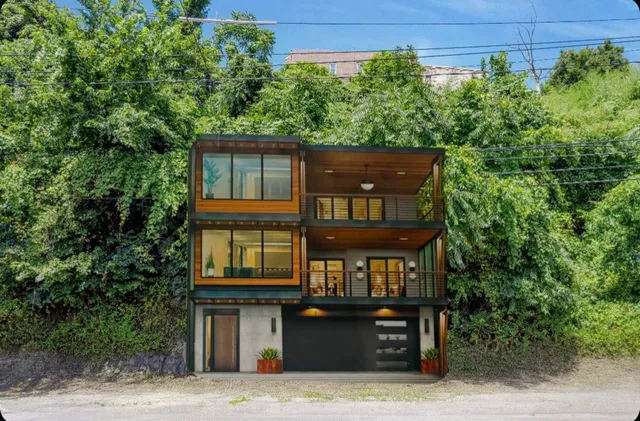 front view of a house with a tree