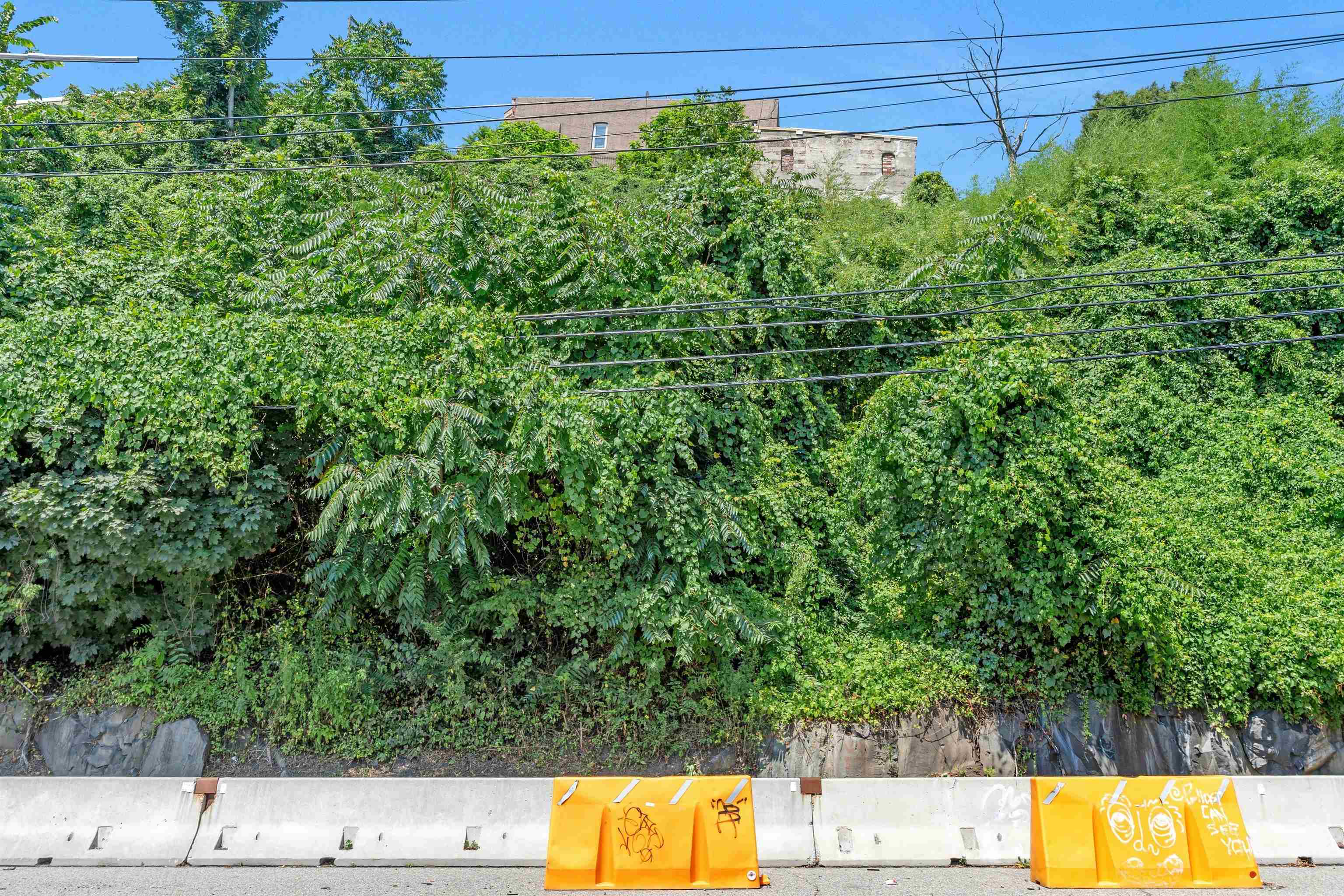 55 Hackensack Plank Road Weehawken, NJ 07086 - Photo 5 of 19 a view of a yard with wooden fence