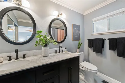 a bedroom with a bed window and table