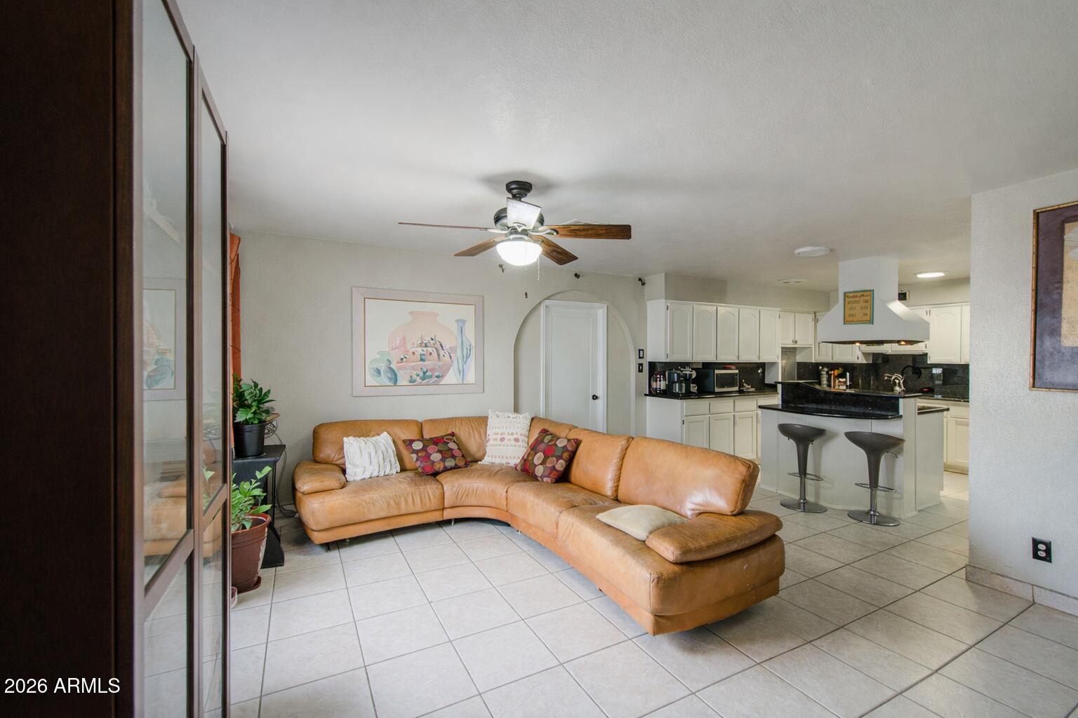 3107 West Montebello Avenue Phoenix, AZ 85017 - Photo 4 of 30 a living room with furniture and kitchen view