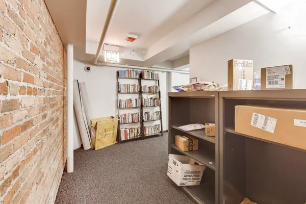 a view of workspace with furniture and window