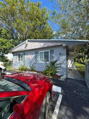 a view of house with outdoor seating