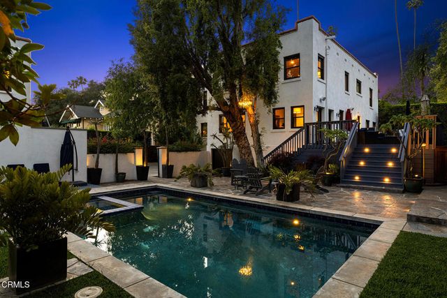 a view of a swimming pool with a patio