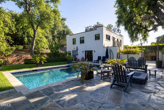 a kitchen with stainless steel appliances a refrigerator sink and microwave