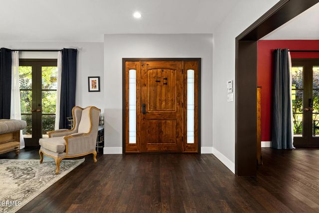 a living room with furniture fireplace and a window