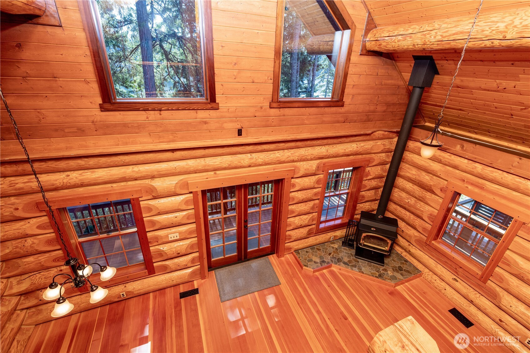 1901 E Trail Belfair, WA 98528 - Photo 9 of 40 a view of a patio with wooden floor and iron stairs