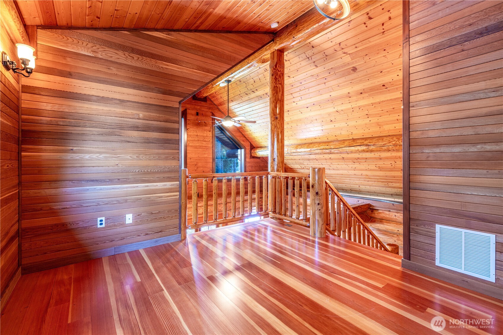 1901 E Trail Belfair, WA 98528 - Photo 10 of 40 a view of a balcony with wooden floor