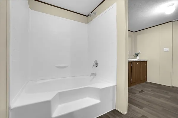 a bathroom with a tub and shower