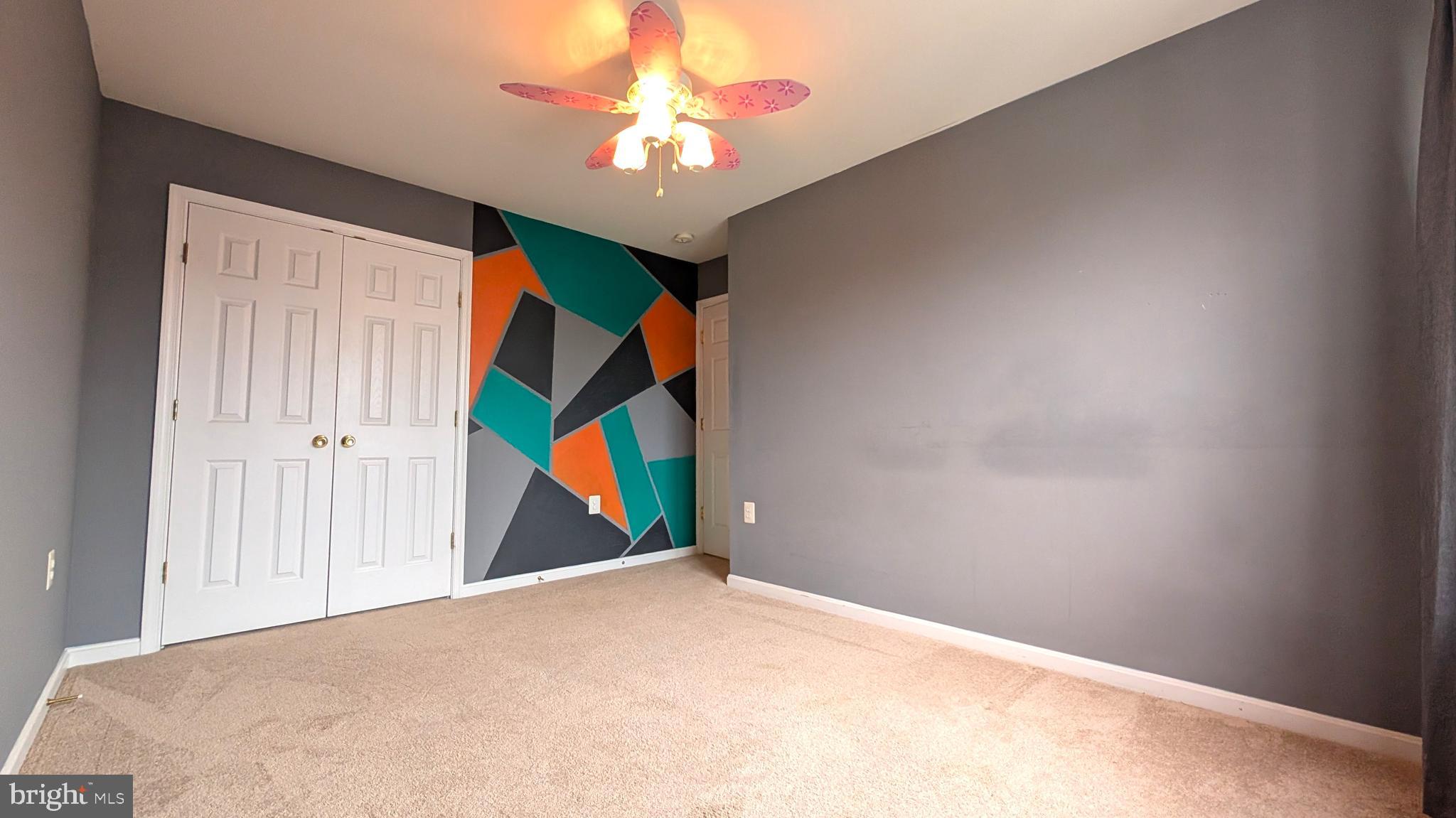 230 Whitman Lane Inwood, WV 25428 - Photo 19 of 29 a view of a room with a ceiling fan and window