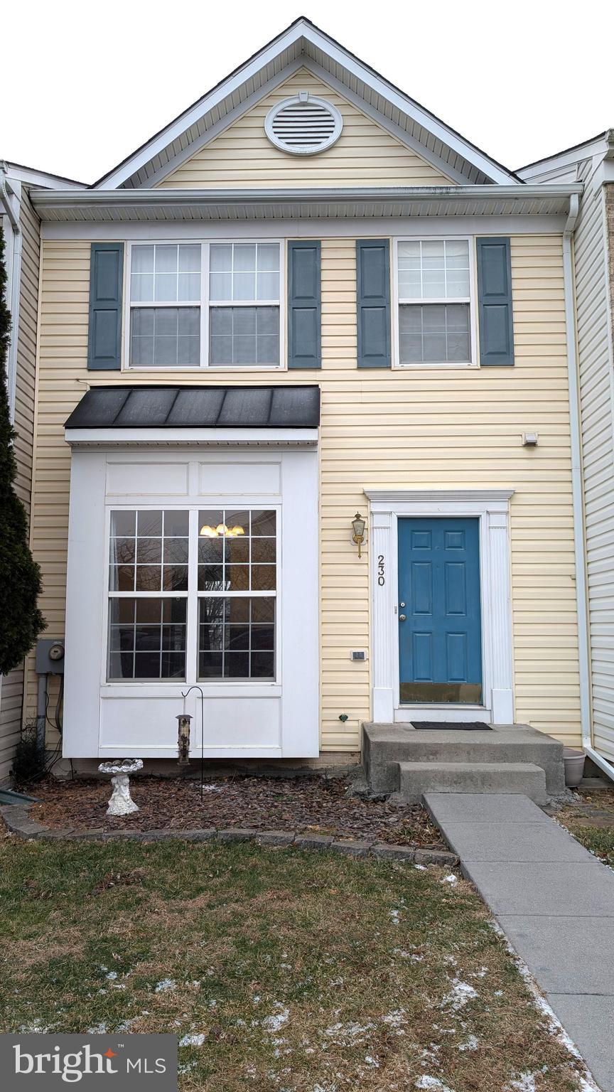 230 Whitman Lane Inwood, WV 25428 - Photo 2 of 29 a front view of a house with a yard and garage