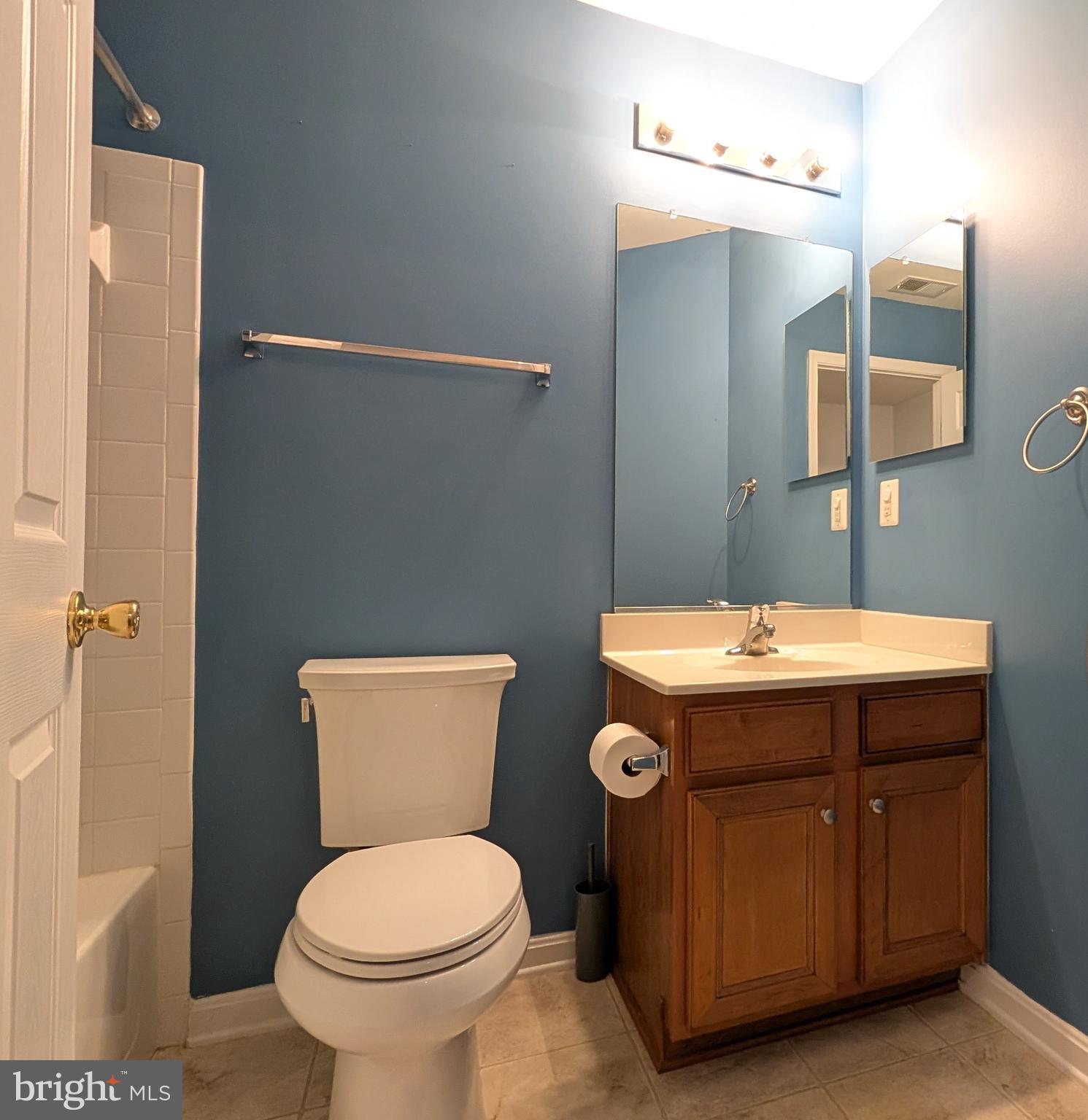 230 Whitman Lane Inwood, WV 25428 - Photo 22 of 29 a bathroom with a toilet sink and mirror