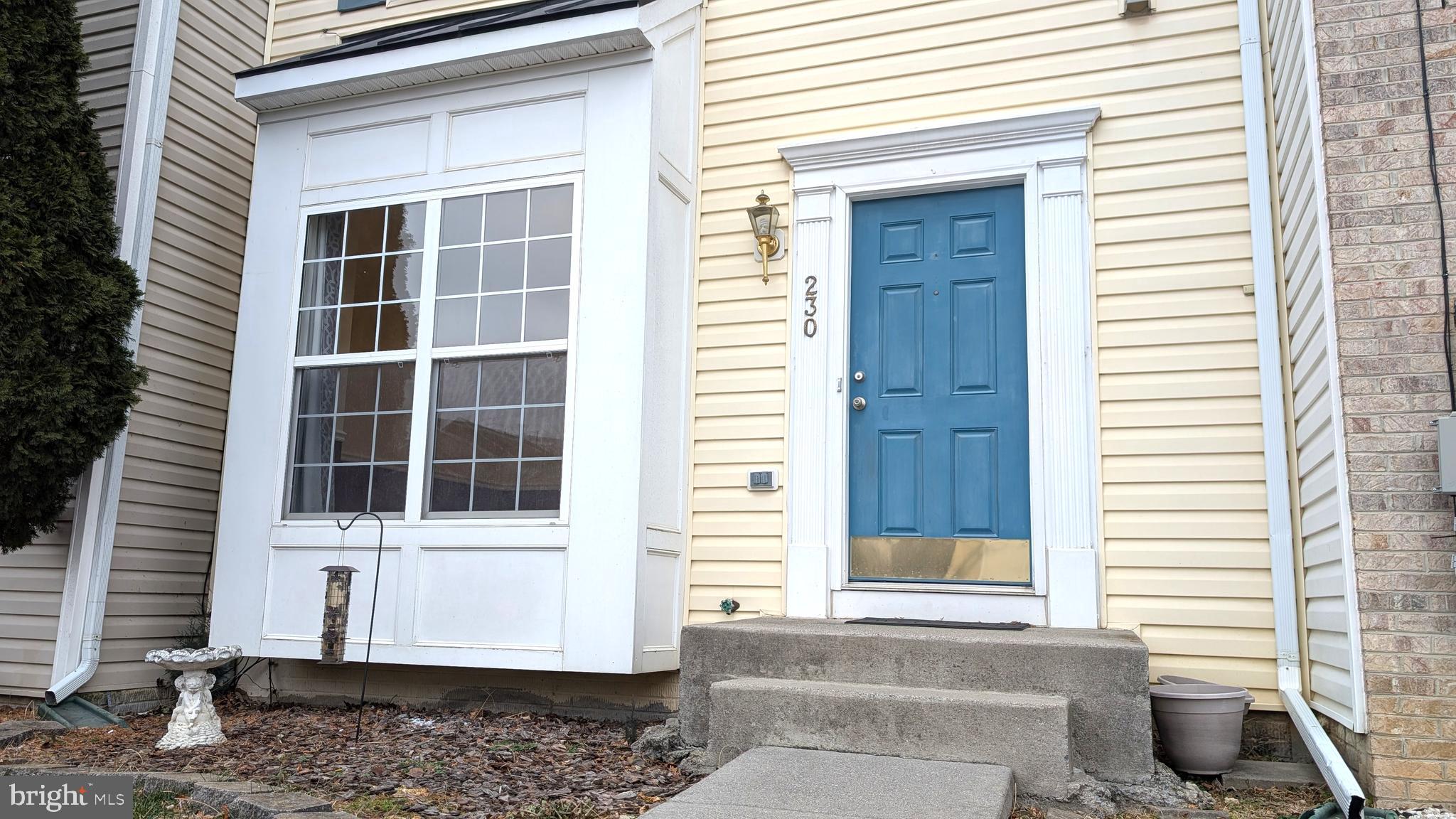 230 Whitman Lane Inwood, WV 25428 - Photo 3 of 29 a view of a house with a door and a window