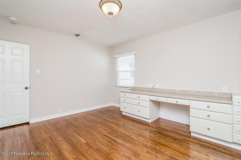1771 North Altadena Drive Altadena, CA 91001 - Photo 19 of 29 a view of a kitchen with wooden floor and cabinets