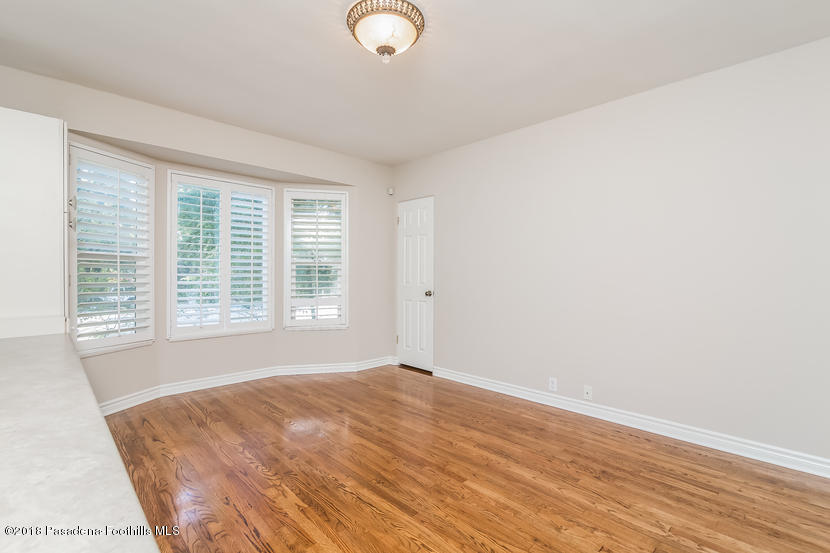 1771 North Altadena Drive Altadena, CA 91001 - Photo 20 of 29 a view of an empty room with wooden floor and a window