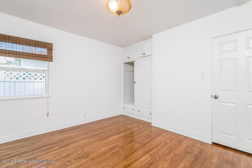 1771 North Altadena Drive Altadena, CA 91001 - Photo 21 of 29 an empty room with wooden floor and windows