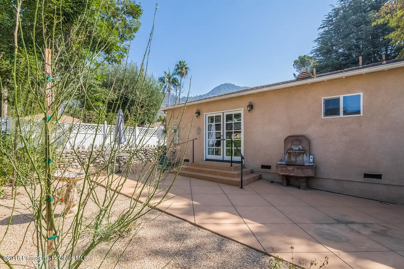 1771 North Altadena Drive Altadena, CA 91001 - Photo 23 of 29 a front view of a house with a garden