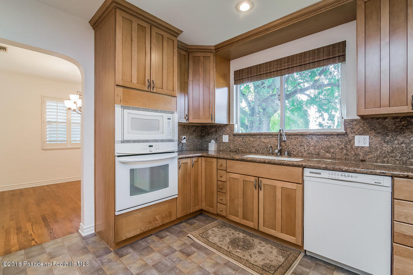 1771 North Altadena Drive Altadena, CA 91001 - Photo 6 of 29 a kitchen with granite countertop a stove a sink and a microwave
