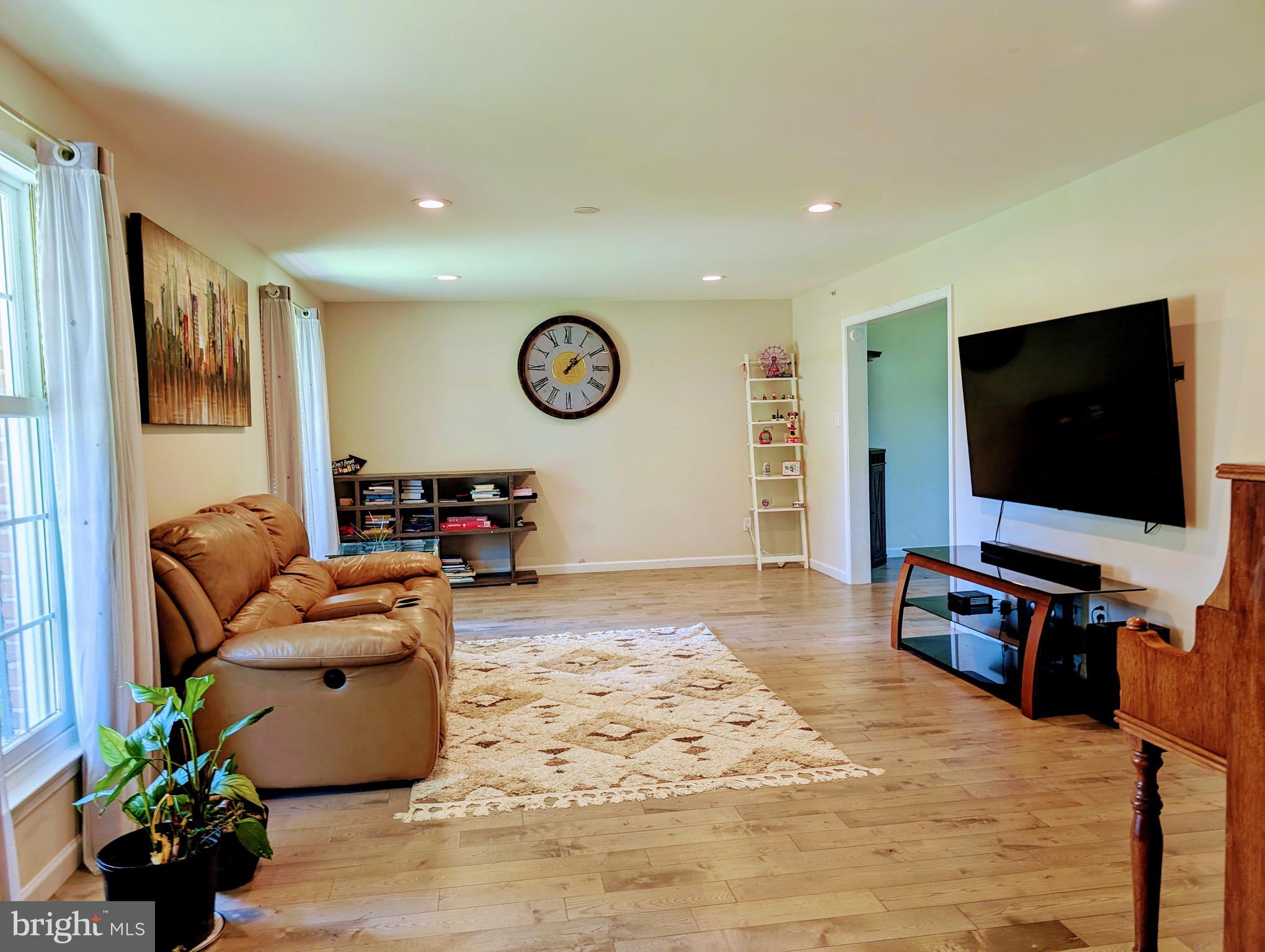 2601 Wayland Road Berwyn, PA 19312 - Photo 8 of 8 a living room with furniture and a flat screen tv