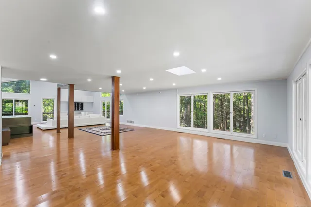 a kitchen with a refrigerator and a counter top space